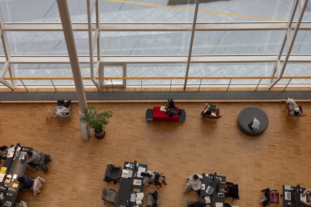 person reading book by window