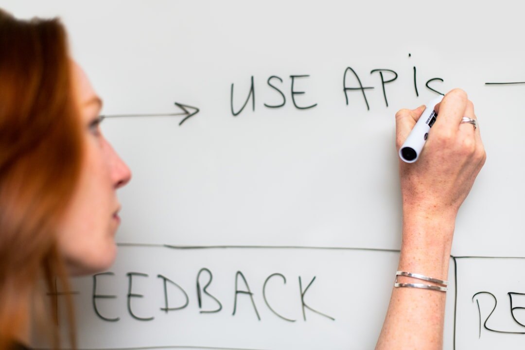 person setting goals on whiteboard