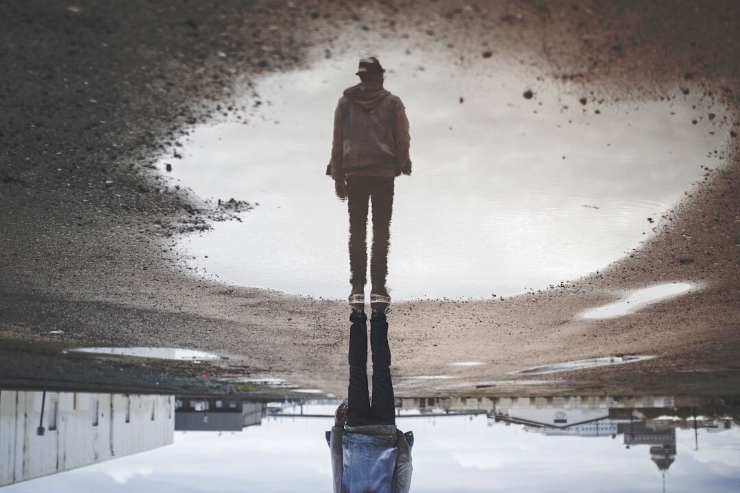 person reflecting in mirror
